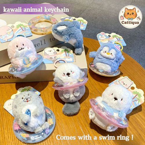 Cute animal keychain collection with swim rings featuring penguin, polar bear, orca, pink dolphin, seal and otter
